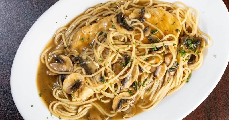 Chicken Marsala served with spaghetti