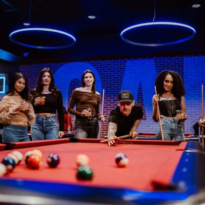 Adults playing pool.