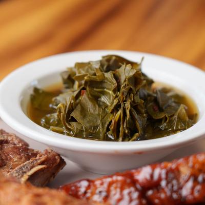 Side portion of collard greens as a part of the meat platter.