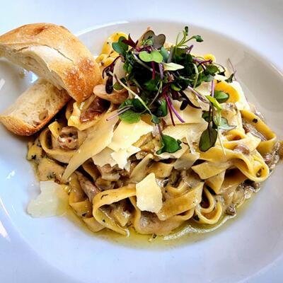 Pappardelle pasta, with mushrooms, cheese, herbs, and bread.