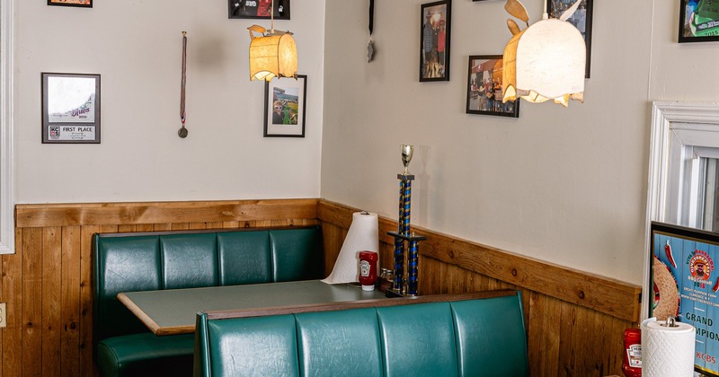 Interior, dining area with green leather booths