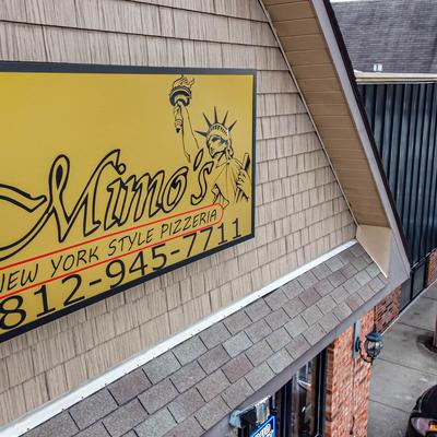 Restaurant exterior, name sign.