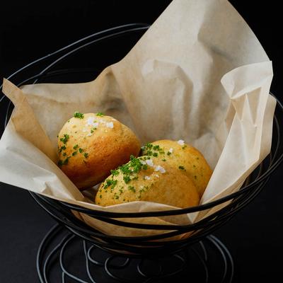 Dinner Rolls served in a basket.