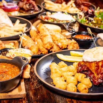 A variety of different dishes on a table, side view.