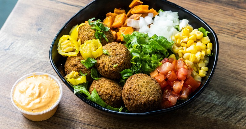 Falafel bowl with dressing on the side
