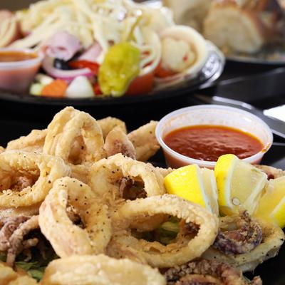 Fried calamari with marinara sauce.
