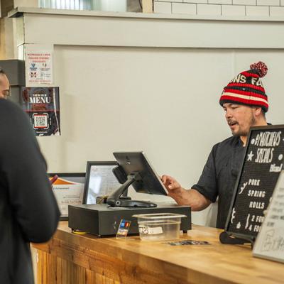 A person working the cash register.