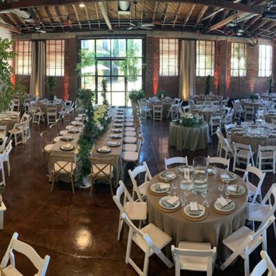 Banquette room with set tables, featuring lots of natural light