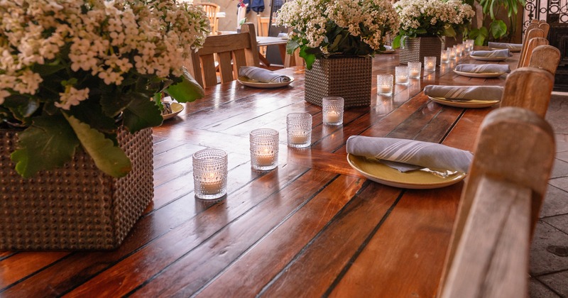 Elegant set table with flowers and candles, close up