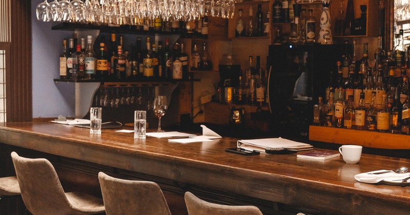 Bar with upholstered stools