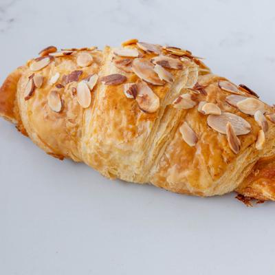 Almond croissant topped with sliced almonds.