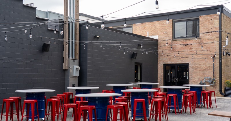 Backyard patio, round bar tables and stools