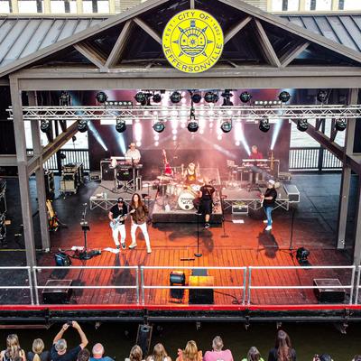 A band performing on the river stage