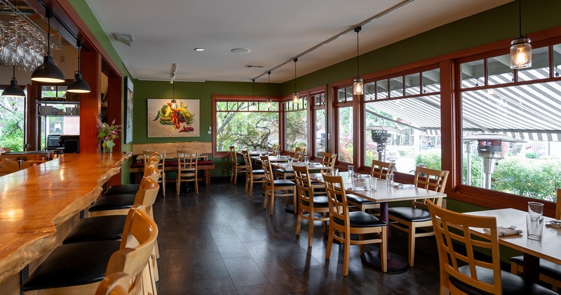 Interior space, dining area with set tables near the bar