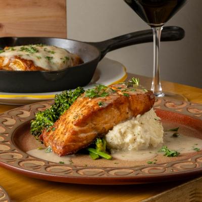 Seared salmon served over potato puree, broccolini, and lemon butter sauce.