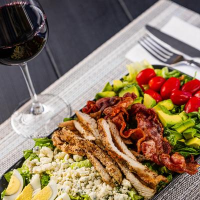Cobb Salad and red wine.