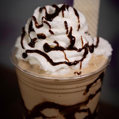 Frappuccino with whipped cream and chocolate drizzle.