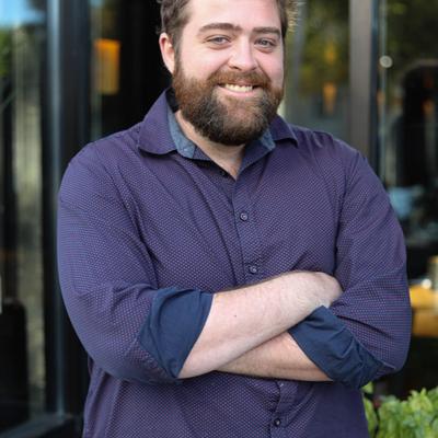 A person posing for a photo and smiling