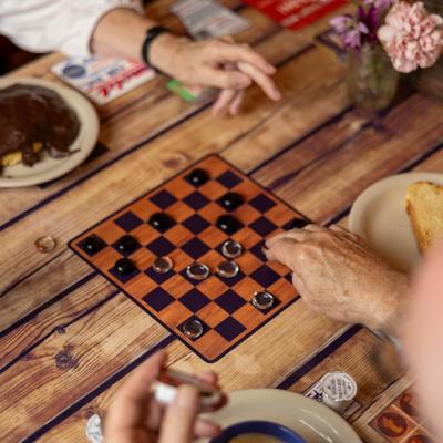 Guests playing a game of checkers.