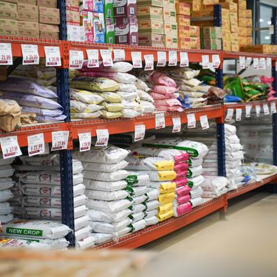 An aisle in the grocery store stocking various bagged goods and products.