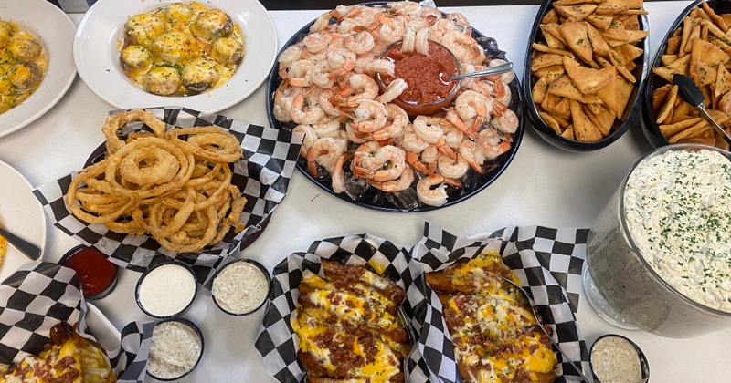 Top view of assorted dish plates spread on a table at a buffet event