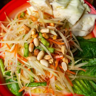 Papaya, green beans, tomato and peanuts, with lime juice, and Thai chili.