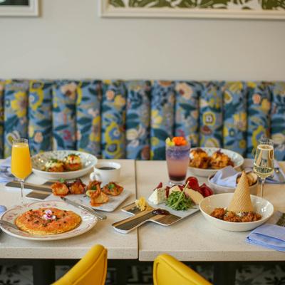 An assortment of food and beverages displayed on a table.