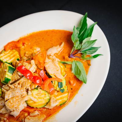 Panang curry with basil garnish.