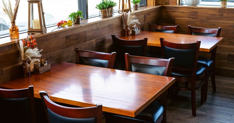 Interior, tables and chairs near window