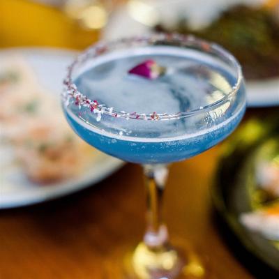 A blue cocktail drink.