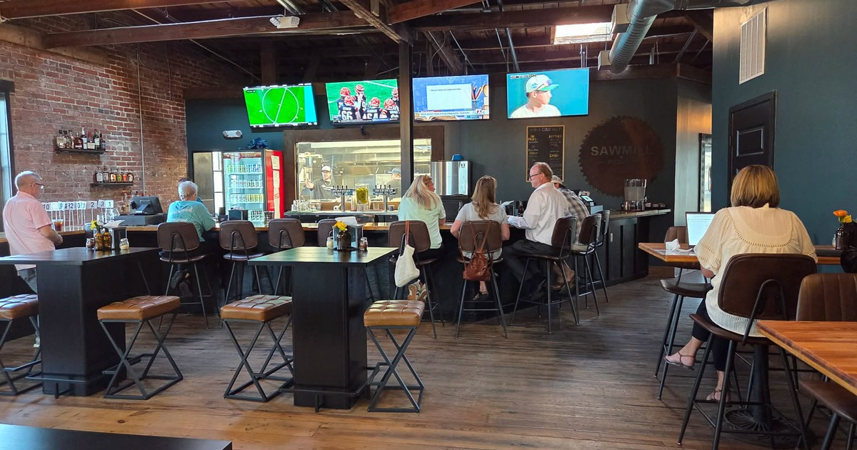 Cozy interior seating area and bar area with guests