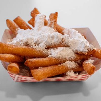 Funnel cake fries topped with powdered sugar.