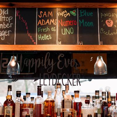 Beer taps, liquor bottles and chalkboard