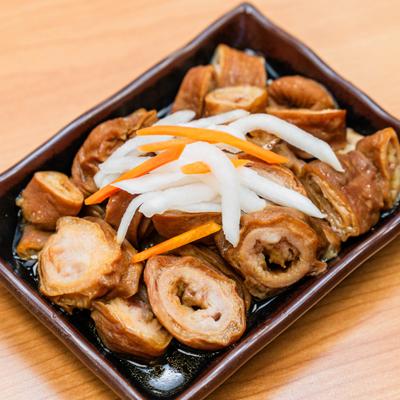 Crispy pork rolls with pickled vegetables.