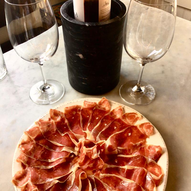 Fed acorn Iberic pork ham & wine house botle photo