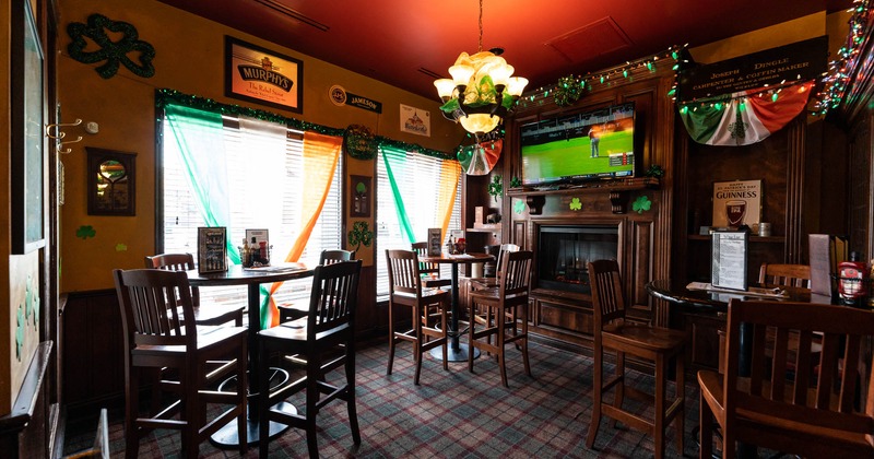 Interior, bar tables and stools, TV on the wall
