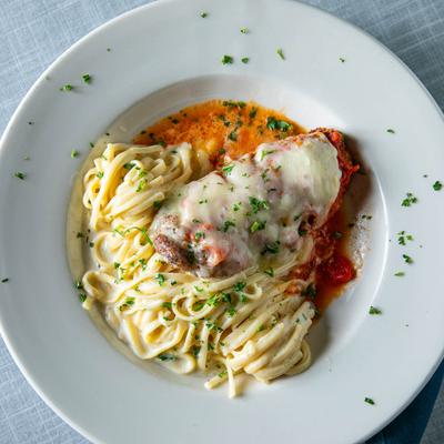 Chicken Parmesan with linguine Alfredo.
