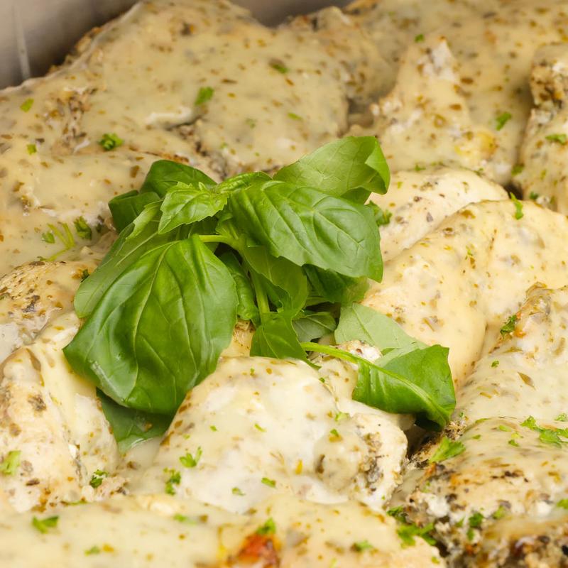 Marinated Grilled Chicken Breast Topped with a Pesto Cream Sauce photo
