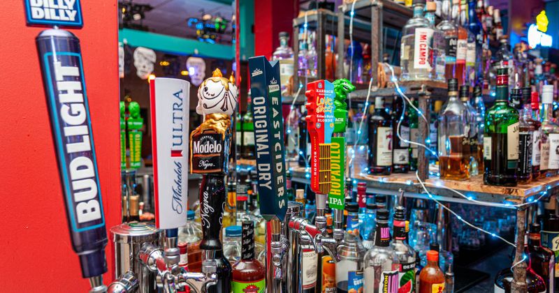 Back bar, beer taps and liquor on bar shelves