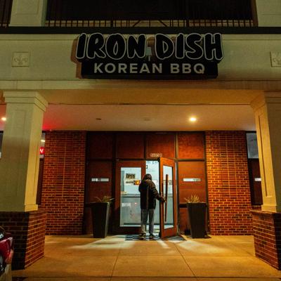 Exterior, storefront with entrance and a sign.