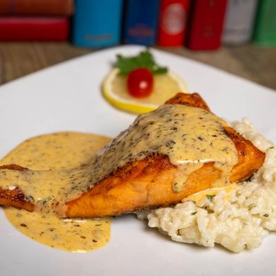 A served Atlantic Salmon with Risotto.