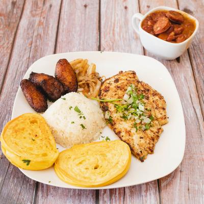 Grilled chicken, rice, plantains, crispy onions, and corn dough.