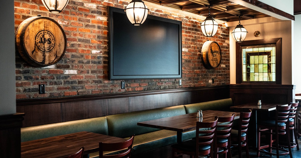 Seating area, a large TV screen on the wall