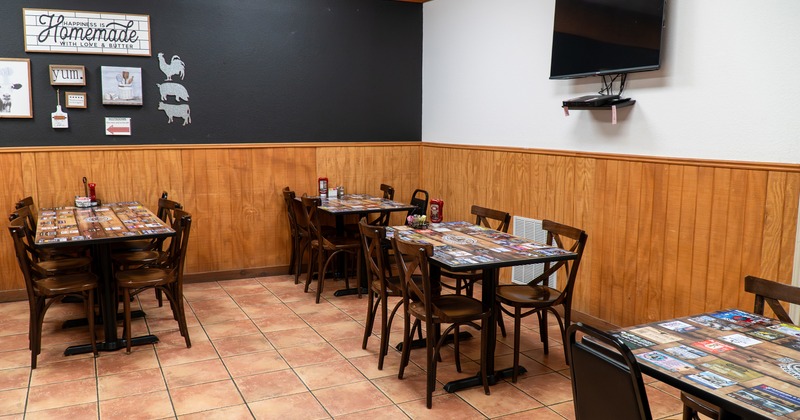 Cozy interior dining area with tables ready for guests