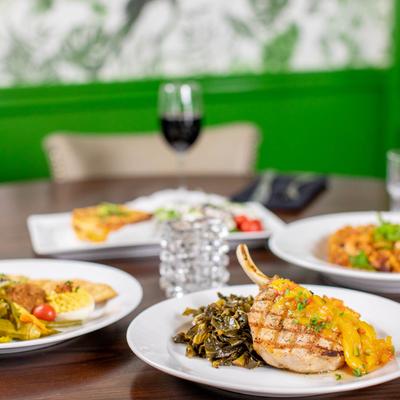 Various types of dishes on a table in dining room