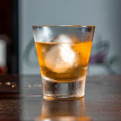 Old Fashioned cocktail, side view.