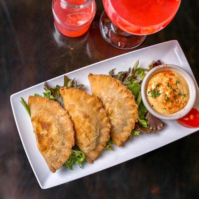 Beef Empanadas, with spicy rocoto sauce.