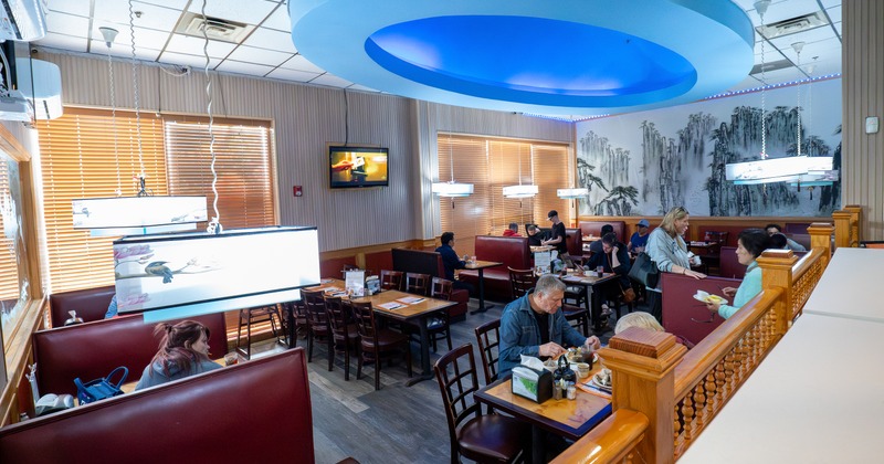 Interior, diner area, tables, chairs, booths, guests