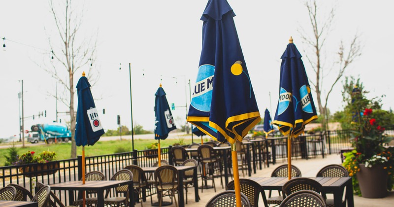 Exterior, tables with parasols and chairs