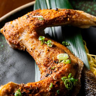 Grilled yellowtail collar, close up.